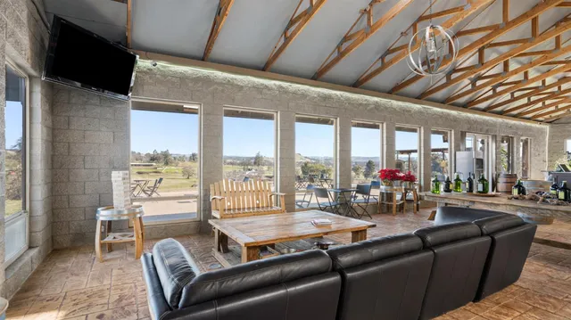 a bottle of wine and a glass of wine sitting on a table