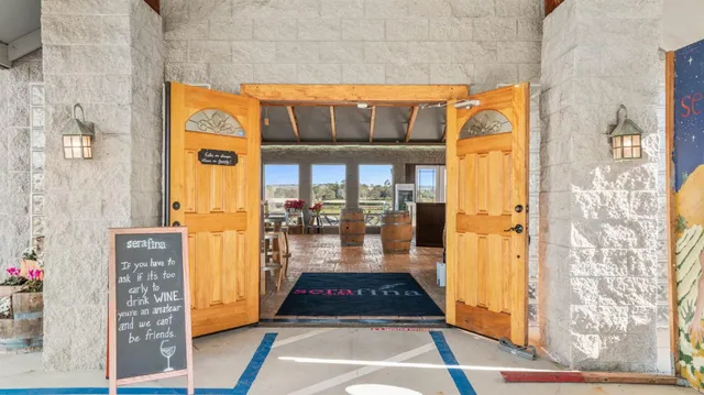 a front view of a house with glass windows and door