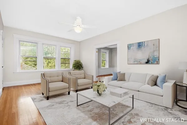 a living room with furniture and a large window