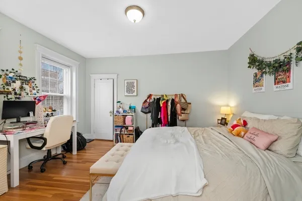 a bed room with a bed and a desk