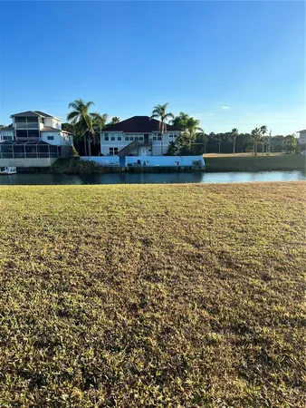 a view of a yard with a lake view