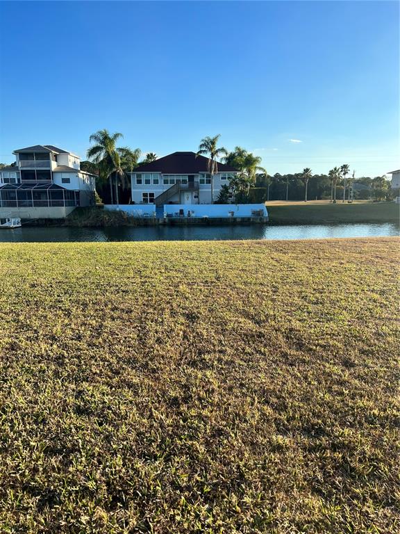 3496 Croaker Drive Hernando Beach, FL 34607 - Photo 6 of 9 a view of a yard with a lake view