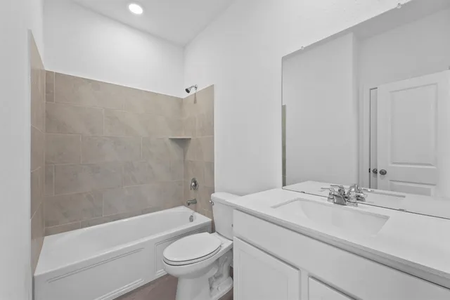 a bathroom with a sink a toilet and a bathtub