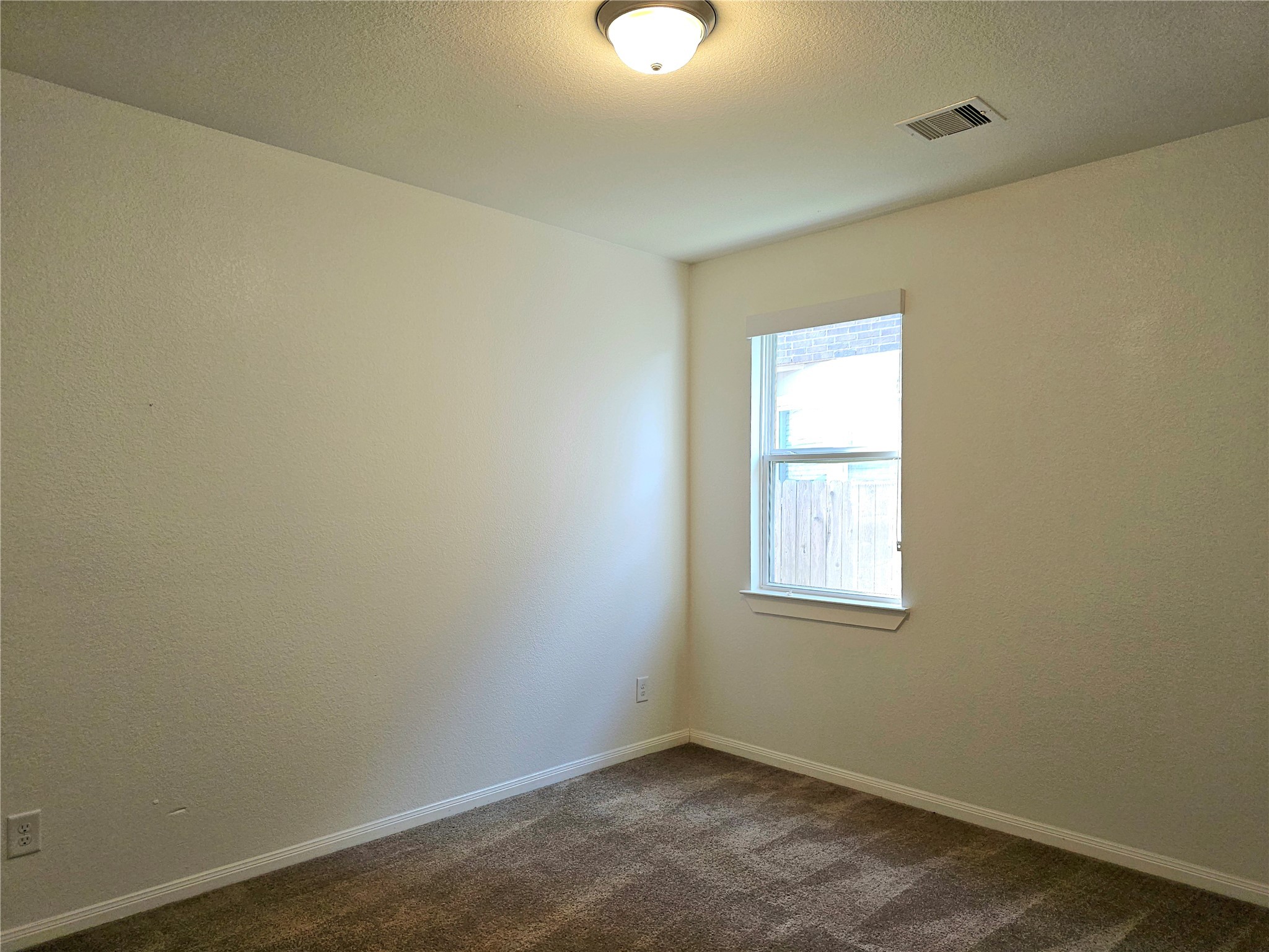 22106 Flashing Ridge Spring, TX 77389 - Photo 21 of 44 an empty room with windows