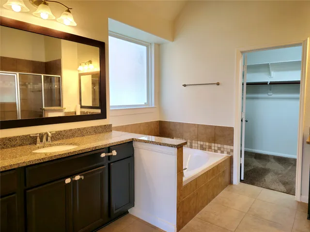 a kitchen with a sink and a refrigerator