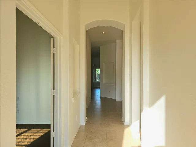 a view of a bathroom from a hallway