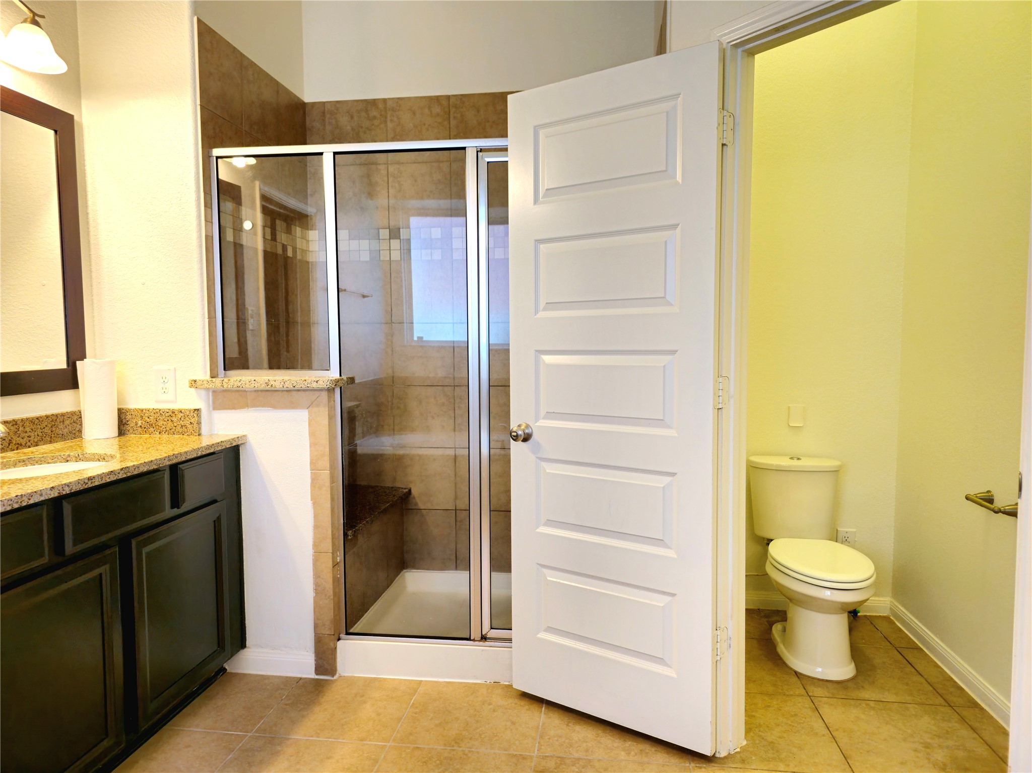 22106 Flashing Ridge Spring, TX 77389 - Photo 32 of 44 a bathroom with a toilet and a shower