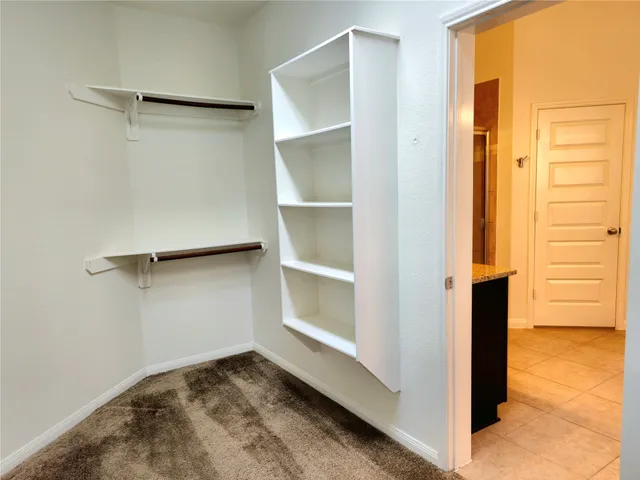 a view of an empty walk in closet