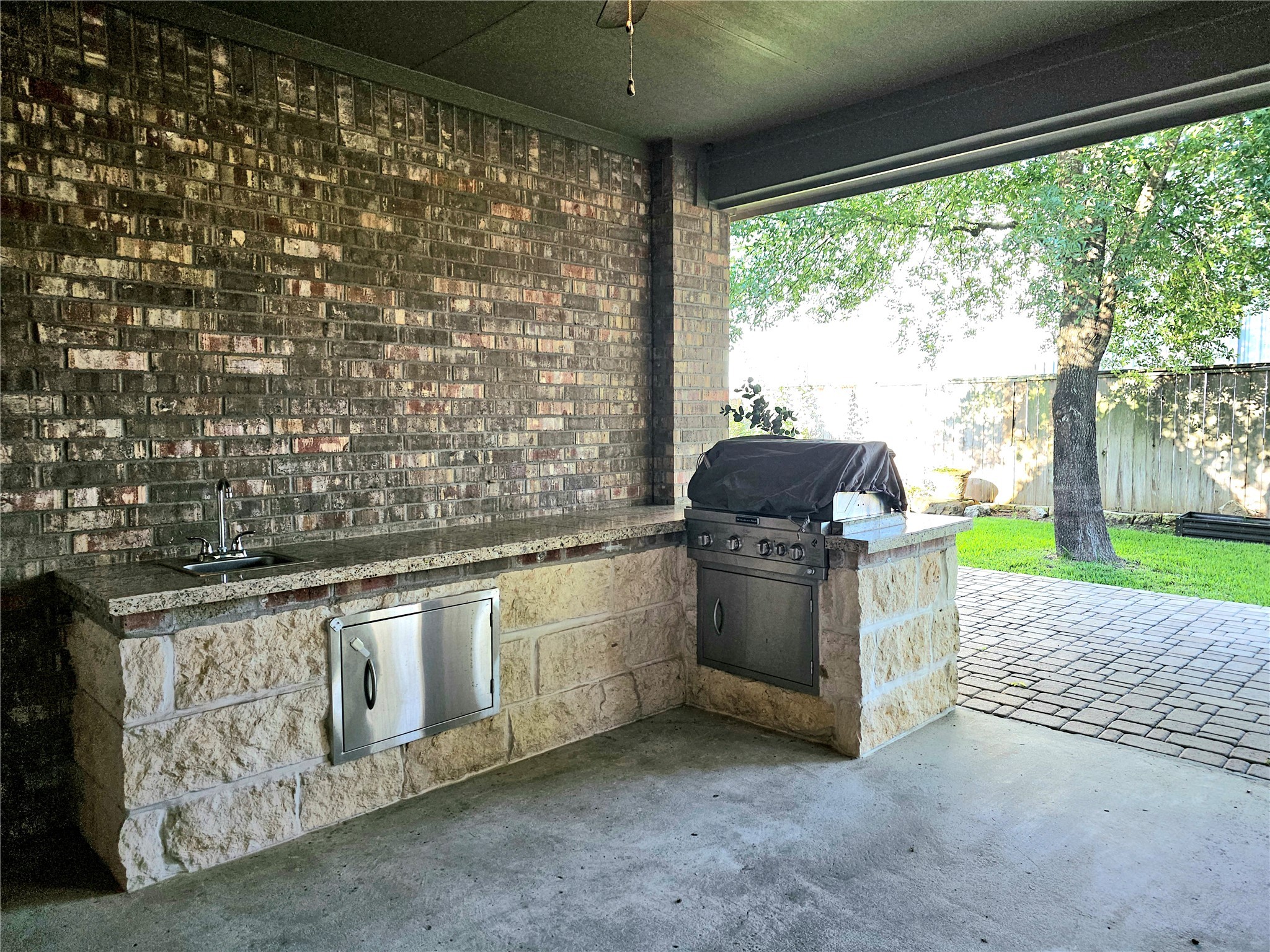 22106 Flashing Ridge Spring, TX 77389 - Photo 35 of 44 a kitchen with stainless steel appliances granite countertop a stove a sink and a microwave