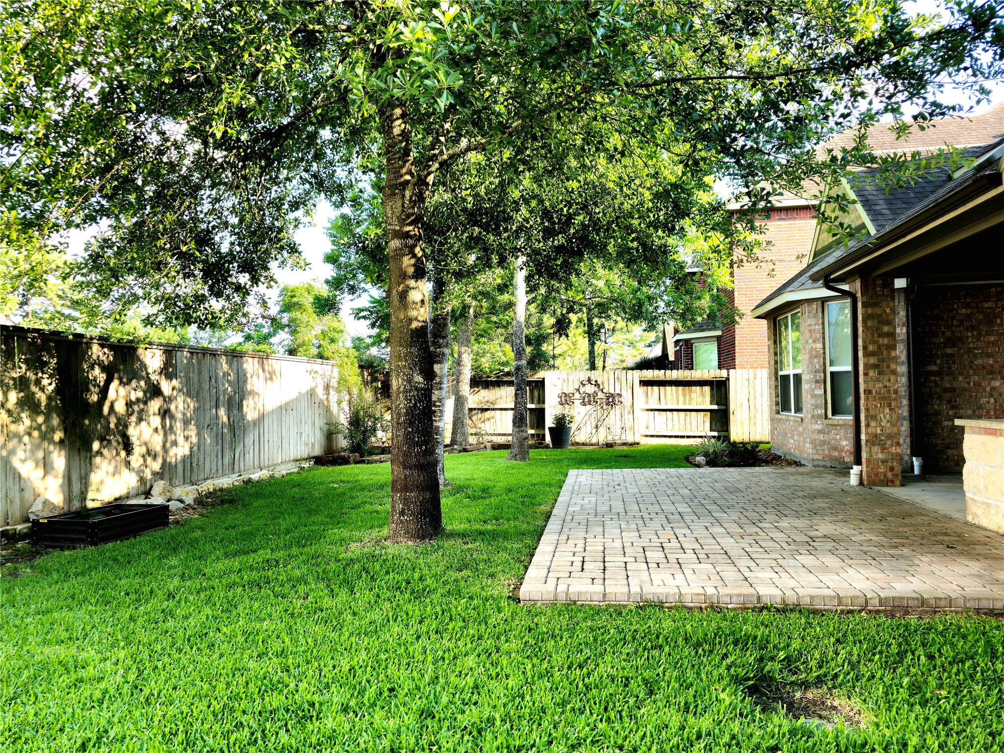 22106 Flashing Ridge Spring, TX 77389 - Photo 37 of 44 a view of a backyard with a garden