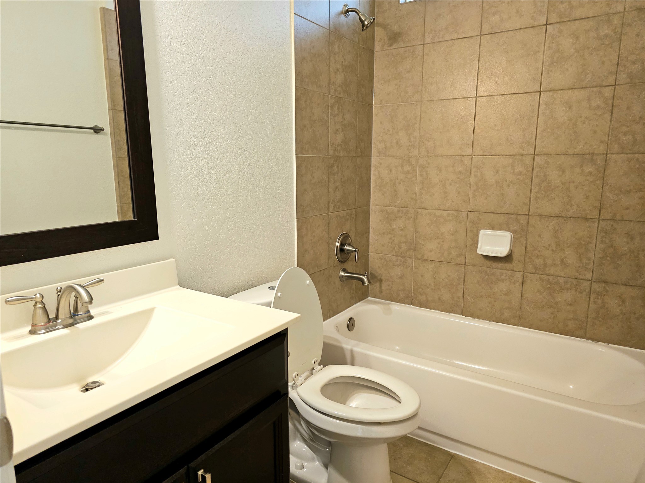22106 Flashing Ridge Spring, TX 77389 - Photo 6 of 44 a bathroom with a sink a toilet and bathtub