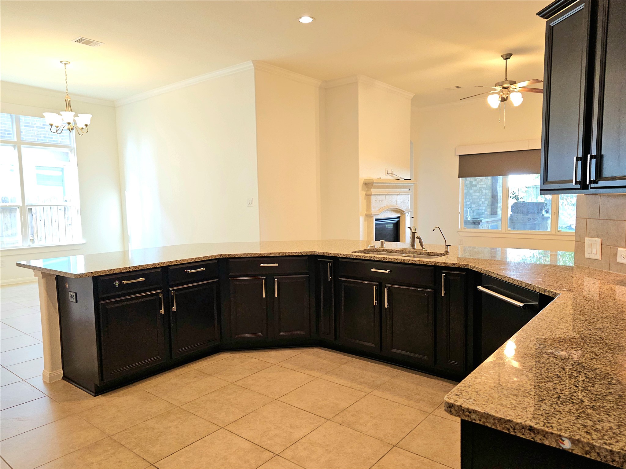 22106 Flashing Ridge Spring, TX 77389 - Photo 10 of 44 a kitchen with granite countertop a sink and cabinets