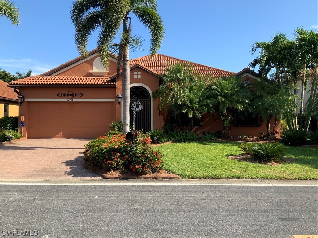 12918 Pastures Way Fort Myers, FL 33913 - Photo 1 of 34 a front view of house with a garden