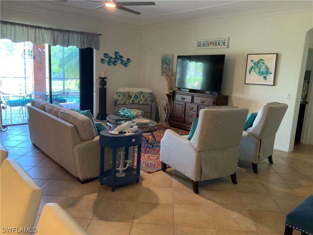 12918 Pastures Way Fort Myers, FL 33913 - Photo 17 of 34 a living room with furniture and a flat screen tv