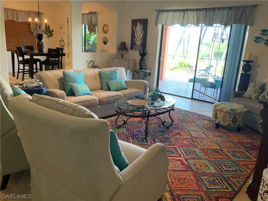 12918 Pastures Way Fort Myers, FL 33913 - Photo 18 of 34 a living room with furniture and a large window