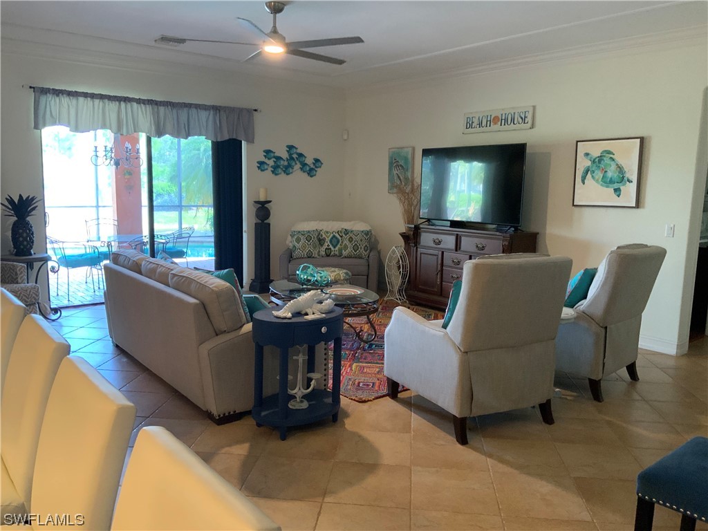 12918 Pastures Way Fort Myers, FL 33913 - Photo 19 of 34 a living room with furniture and a flat screen tv