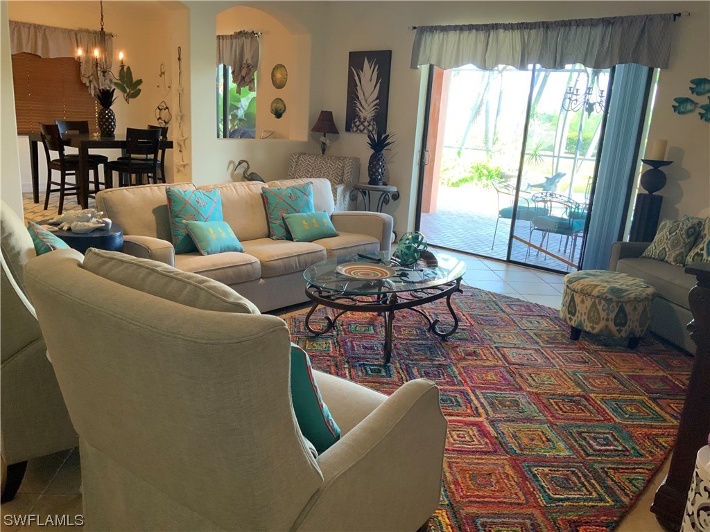 12918 Pastures Way Fort Myers, FL 33913 - Photo 20 of 34 a living room with furniture and a large window