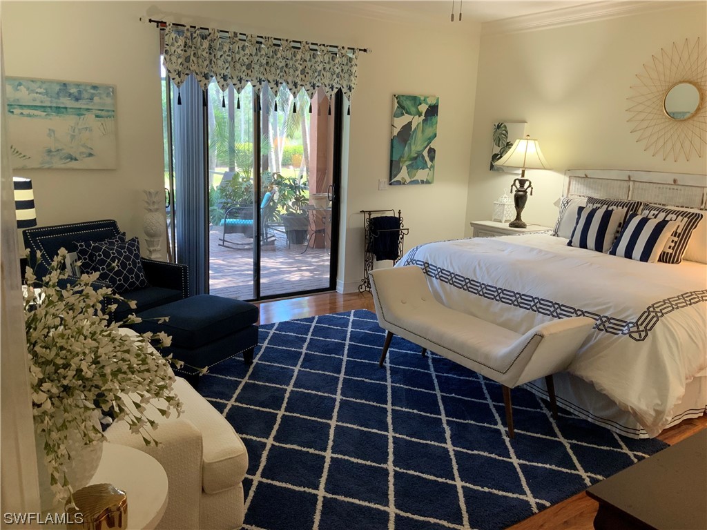 12918 Pastures Way Fort Myers, FL 33913 - Photo 22 of 34 a bedroom with a bed and a window