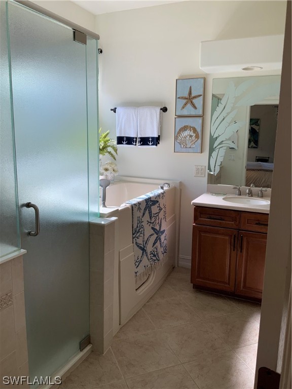 12918 Pastures Way Fort Myers, FL 33913 - Photo 25 of 34 a bathroom with a bathtub sink and mirror