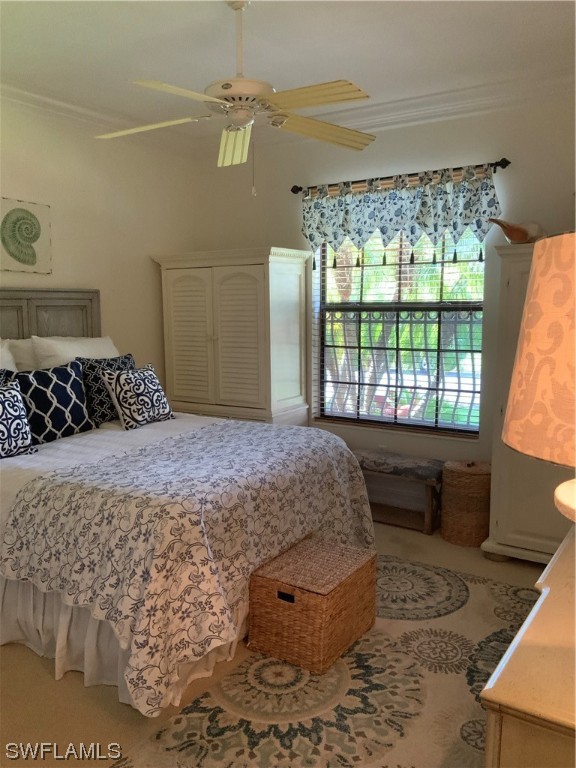 12918 Pastures Way Fort Myers, FL 33913 - Photo 30 of 34 a bedroom with a bed and a window