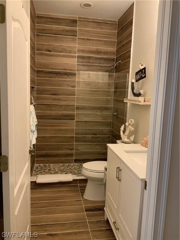 12918 Pastures Way Fort Myers, FL 33913 - Photo 32 of 34 a bathroom with a sink toilet and shower