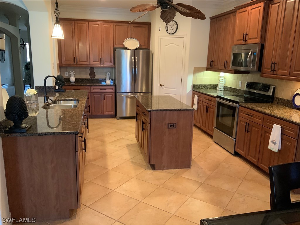 12918 Pastures Way Fort Myers, FL 33913 - Photo 6 of 34 a kitchen with a sink cabinets and appliances