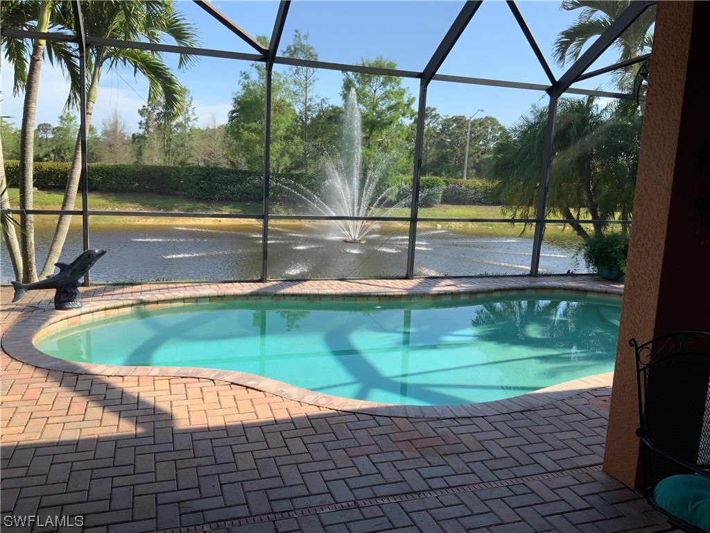 12918 Pastures Way Fort Myers, FL 33913 - Photo 9 of 34 a view of a swimming pool with a yard
