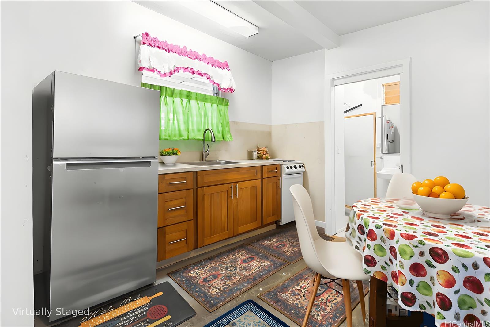 47-325 Ahuimanu Road Kaneohe, HI 96744 - Photo 20 of 24 a kitchen with a refrigerator and countertop