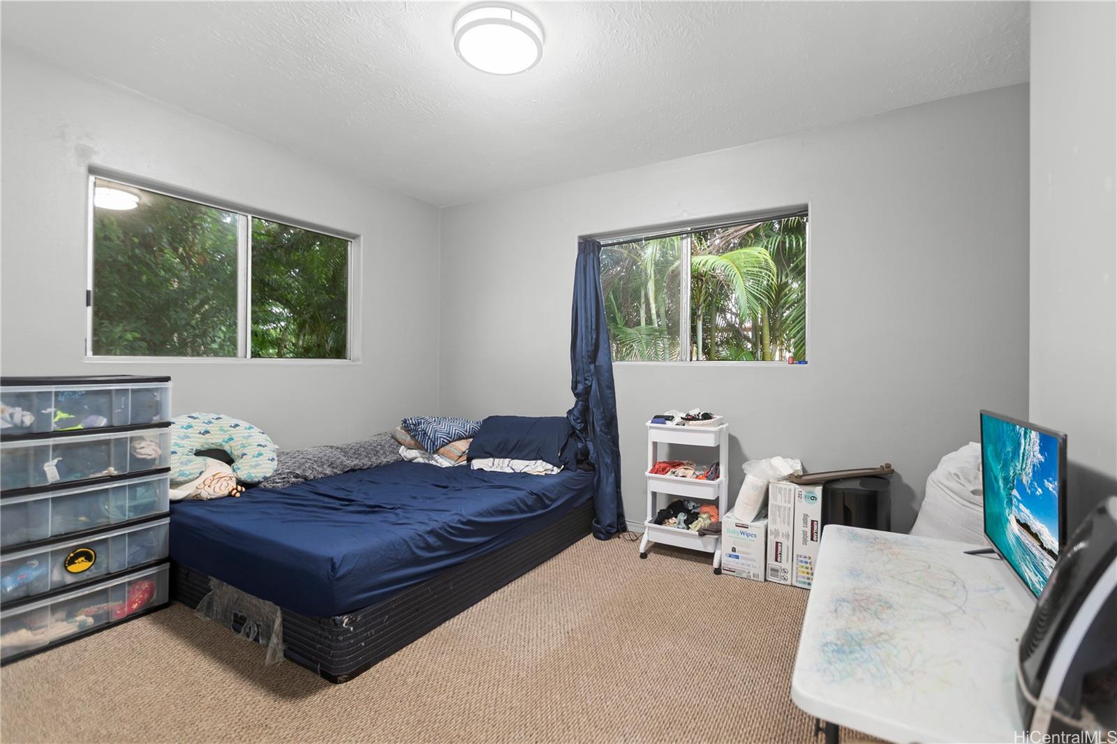47-325 Ahuimanu Road Kaneohe, HI 96744 - Photo 22 of 24 a living room with furniture and a window