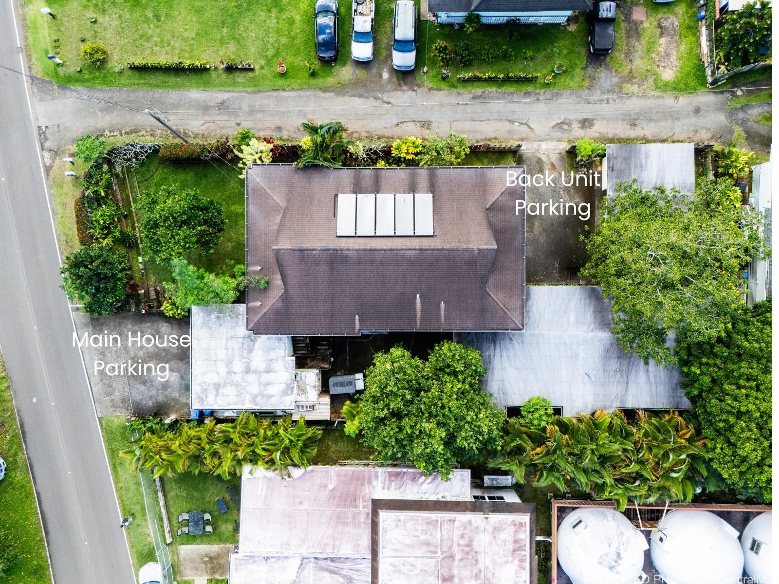 47-325 Ahuimanu Road Kaneohe, HI 96744 - Photo 4 of 24 an aerial view of a house with a yard and a garden