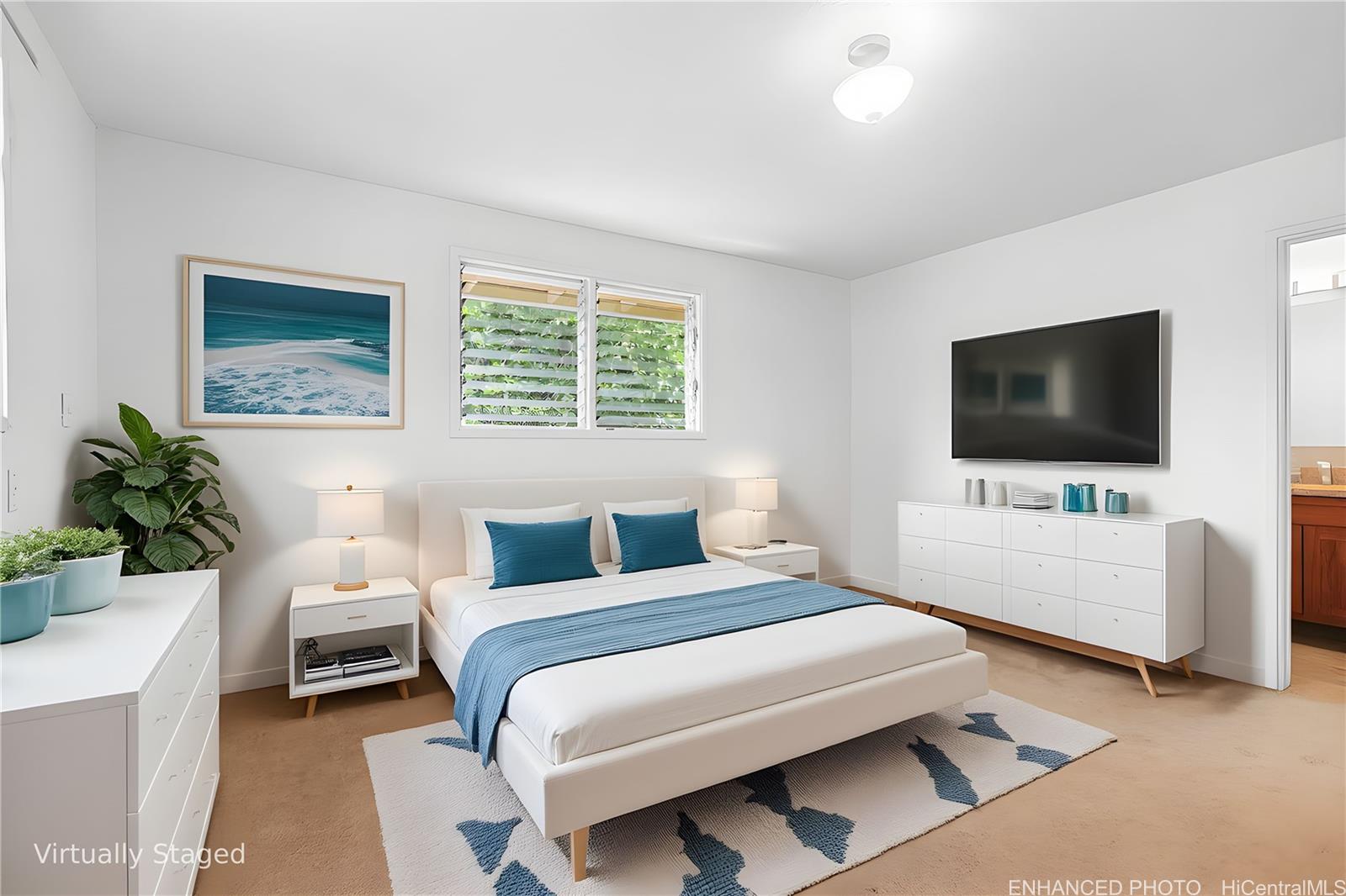 47-325 Ahuimanu Road Kaneohe, HI 96744 - Photo 9 of 24 a bedroom with a bed and a flat screen tv