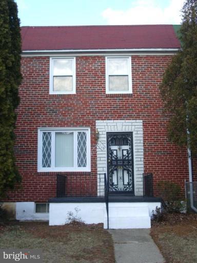 1119 Wicklow Road Baltimore, MD 21229 - Photo 1 of 11 a front view of a house with yard