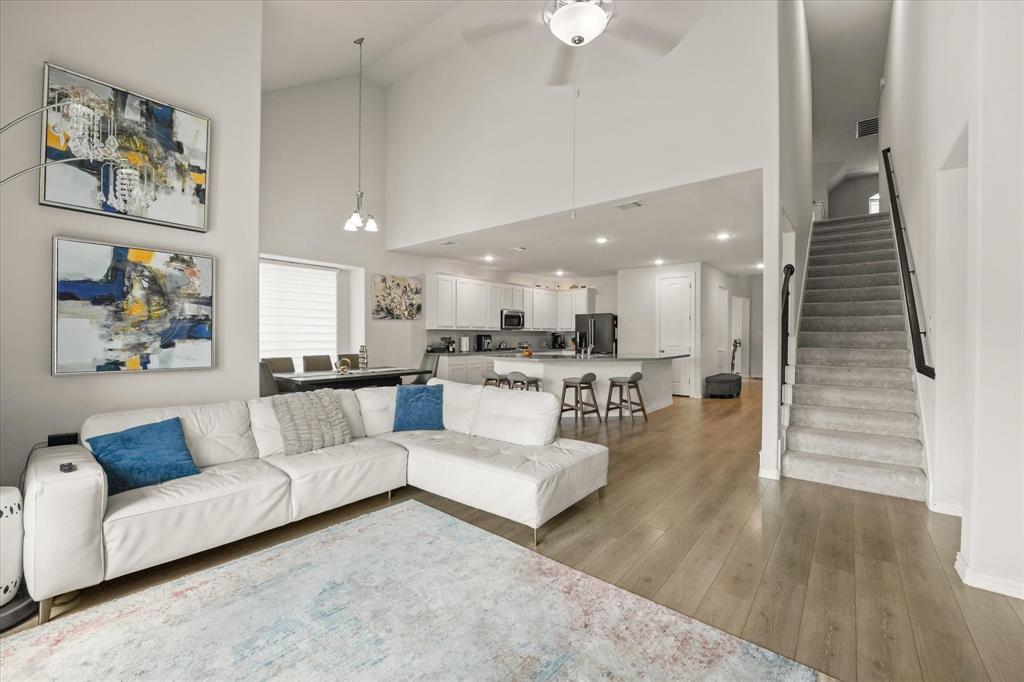 3217 Flowering Peach Dr. Heath, TX 75126 - Photo 12 of 30 a living room with furniture and a wooden floor