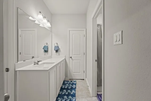 a bathroom with 2 sink and a mirror