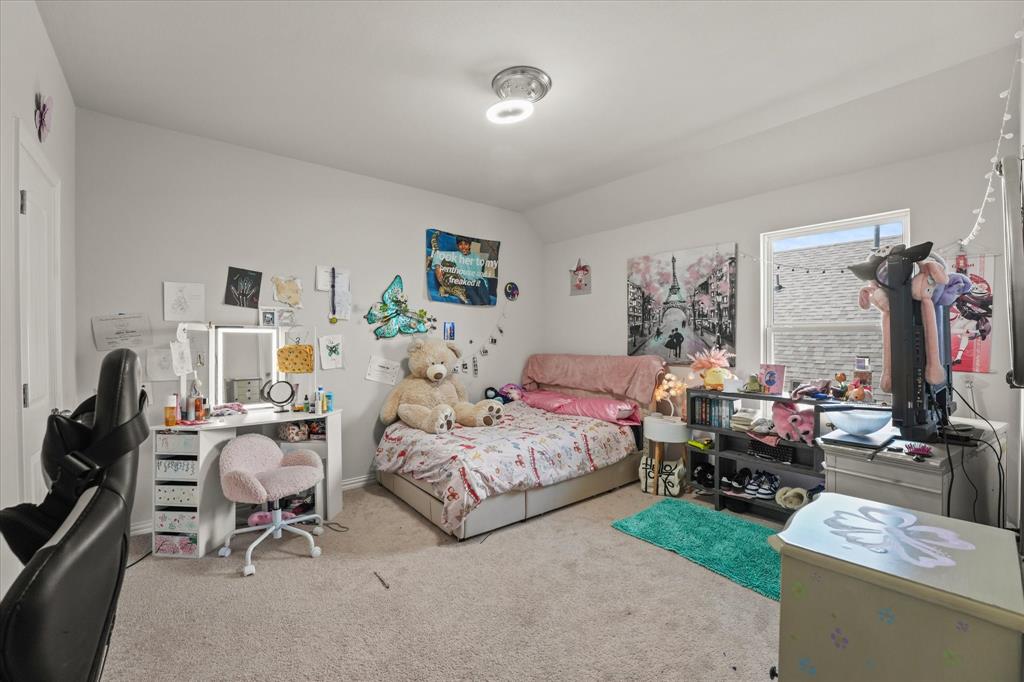 3217 Flowering Peach Dr. Heath, TX 75126 - Photo 20 of 30 a bedroom with two beds and a dresser