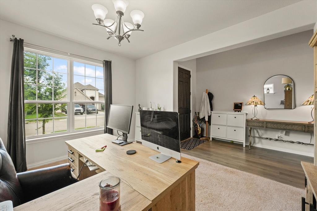 3217 Flowering Peach Dr. Heath, TX 75126 - Photo 4 of 30 a view of a workspace with furniture and a window