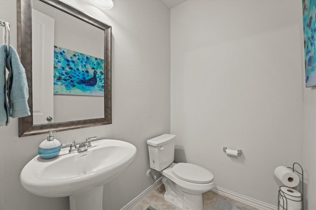 3217 Flowering Peach Dr. Heath, TX 75126 - Photo 6 of 30 a bathroom with a sink and a toilet
