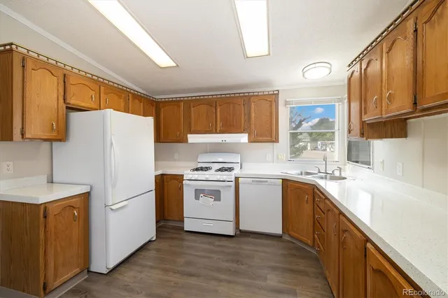 a kitchen with a white cabinets and white appliances