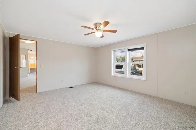 a view of an empty room with a window