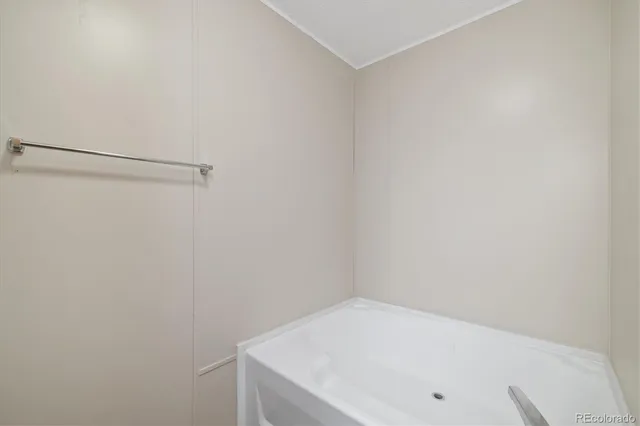 a bathroom with a sink and cabinets