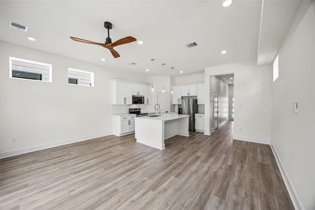 a view of kitchen with wooden floor and window