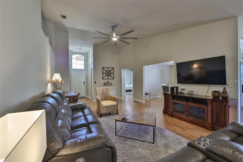 128 Lookout Drive Apollo Beach, FL 33572 - Photo 12 of 36 a living room with furniture and a flat screen tv