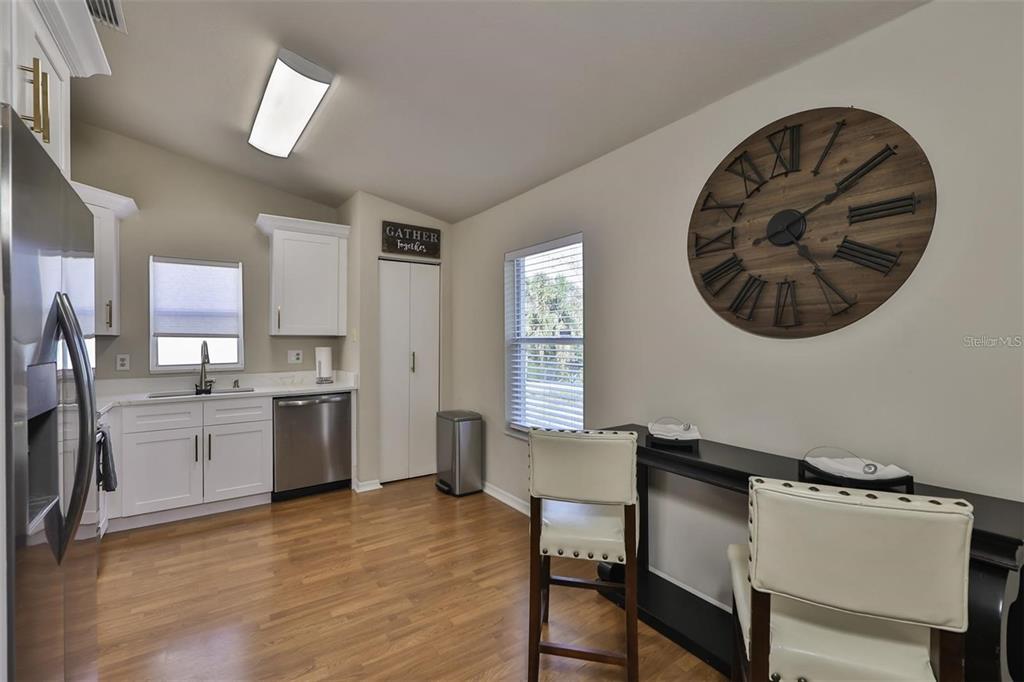 128 Lookout Drive Apollo Beach, FL 33572 - Photo 13 of 36 a kitchen with a cabinets and chair