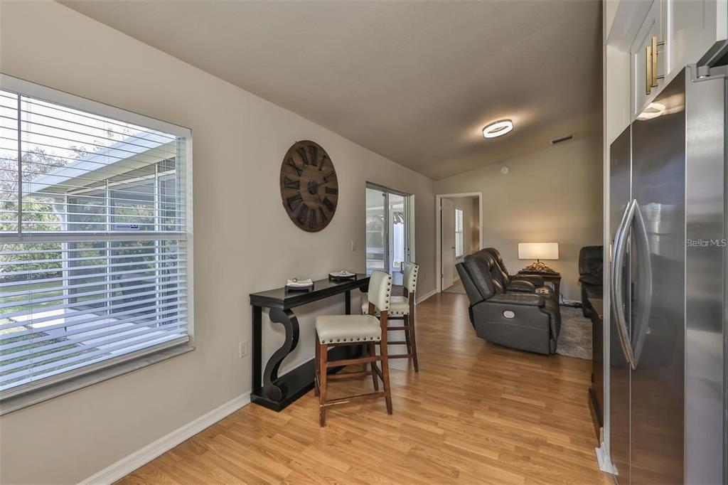 128 Lookout Drive Apollo Beach, FL 33572 - Photo 15 of 36 a living room with furniture and a window