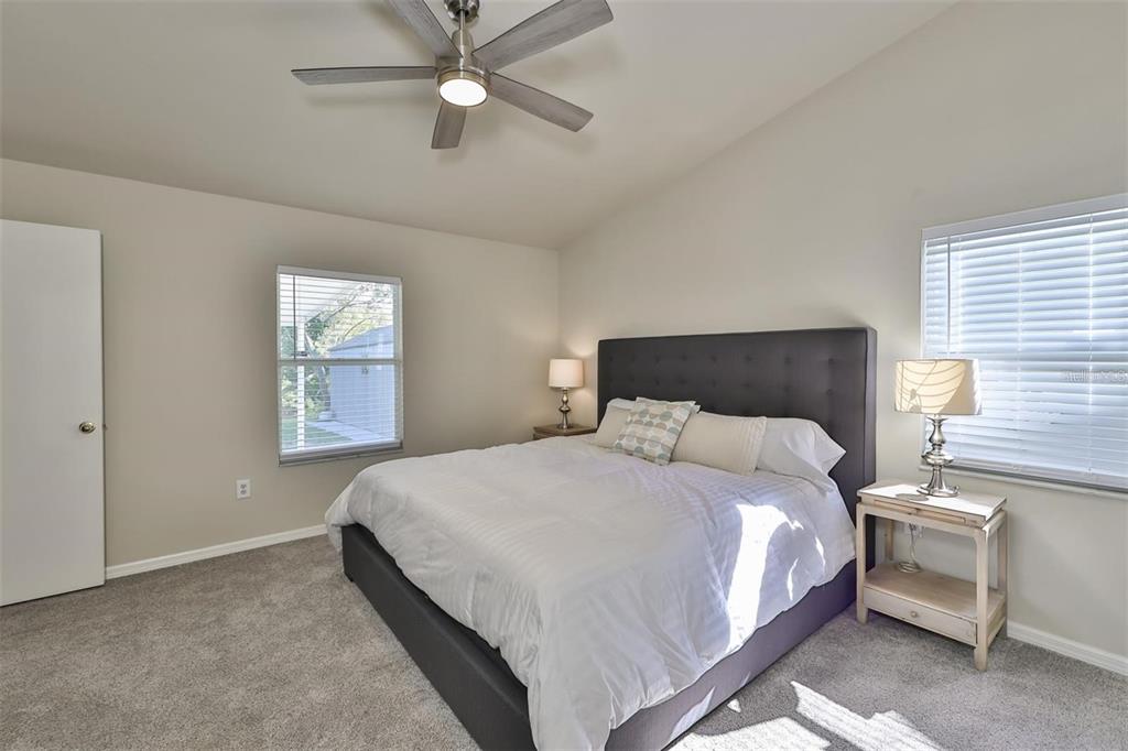 128 Lookout Drive Apollo Beach, FL 33572 - Photo 17 of 36 a bedroom with a bed and window