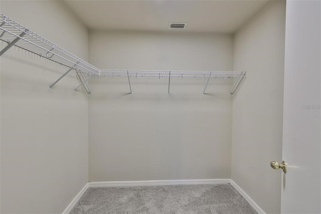 128 Lookout Drive Apollo Beach, FL 33572 - Photo 21 of 36 a view of a room with racks on the wall