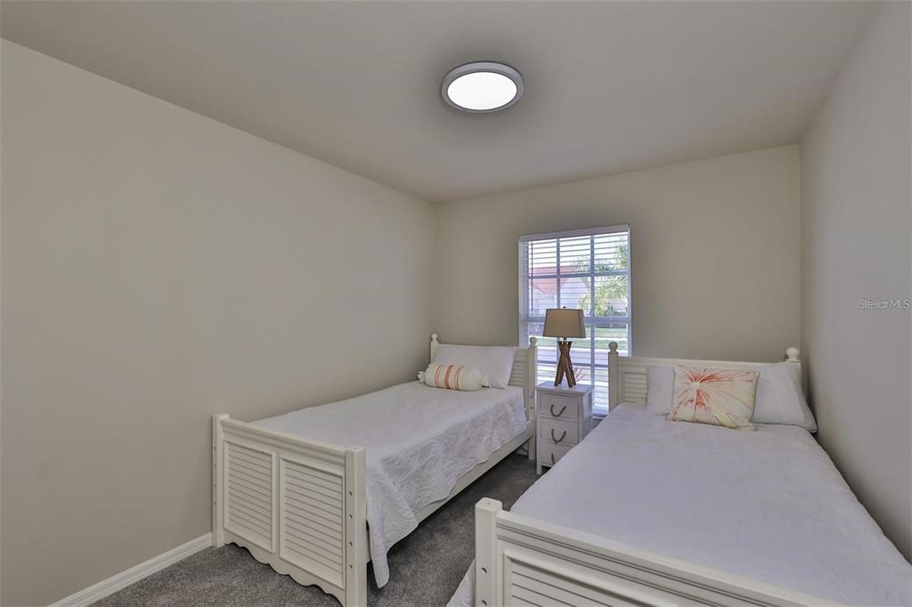 128 Lookout Drive Apollo Beach, FL 33572 - Photo 25 of 36 a bedroom with a bed and window