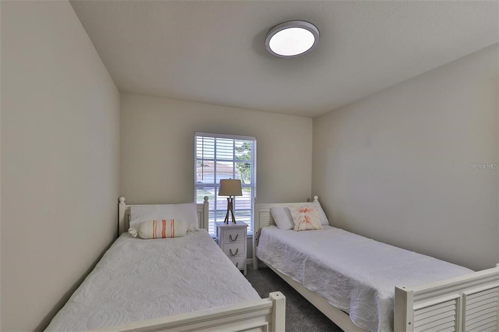 128 Lookout Drive Apollo Beach, FL 33572 - Photo 26 of 36 a bedroom with a bed and window