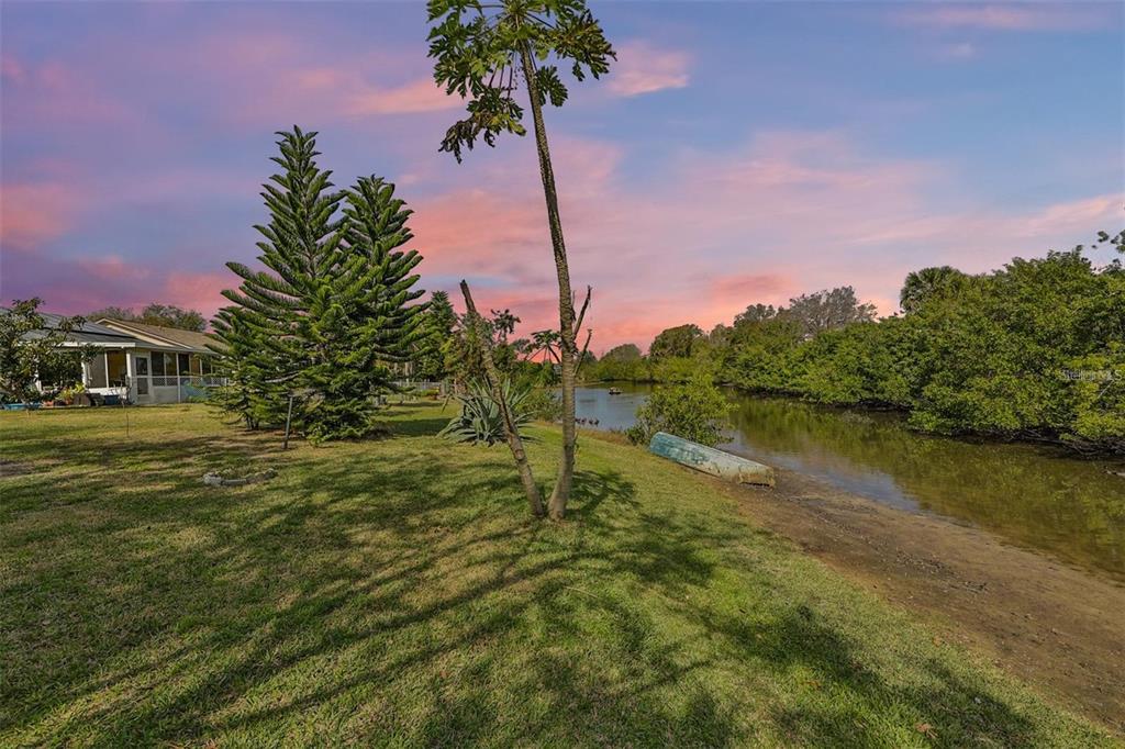 128 Lookout Drive Apollo Beach, FL 33572 - Photo 3 of 36 a lake view with a garden
