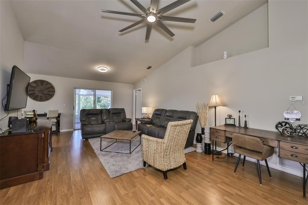 128 Lookout Drive Apollo Beach, FL 33572 - Photo 4 of 36 a living room with furniture and wooden floor